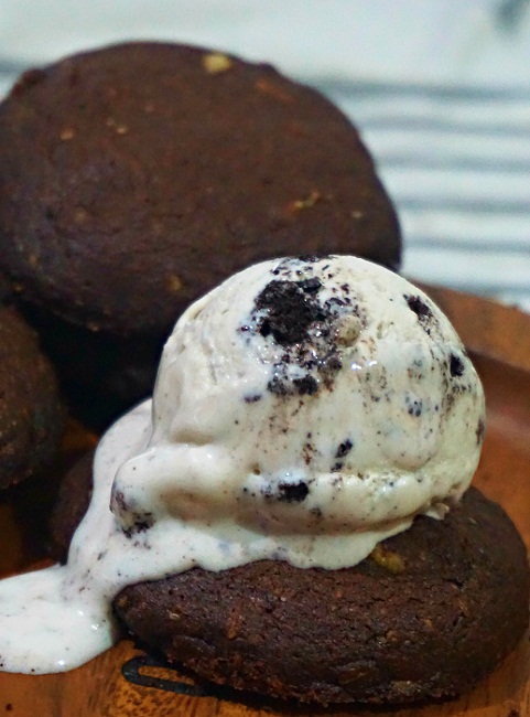 chocolate granola cookie with cookies and cream ice cream on top